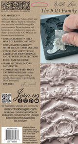 Hand pressing tool into Cadré Mould by Iron Orchid Designs with brand text overlay on ornate silicone surface.