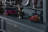 Dark blue cabinet painted with Cambridge Fusion Mineral Paint, displaying grapes, eggplants, a bowl, and two feathers.