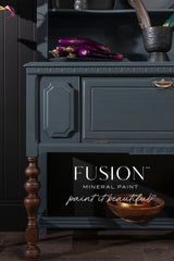 Teal cabinet with wooden legs, eggplants, and Fusion Mineral Paint Cambridge in dark blue.