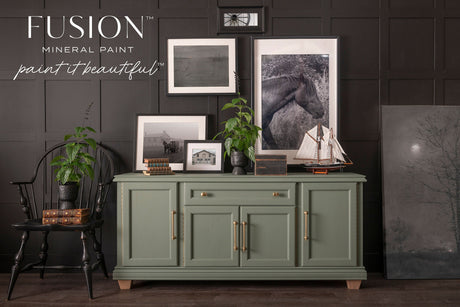 Green sideboard painted in Carriage House Fusion Mineral Paint, shown with decor items on top.