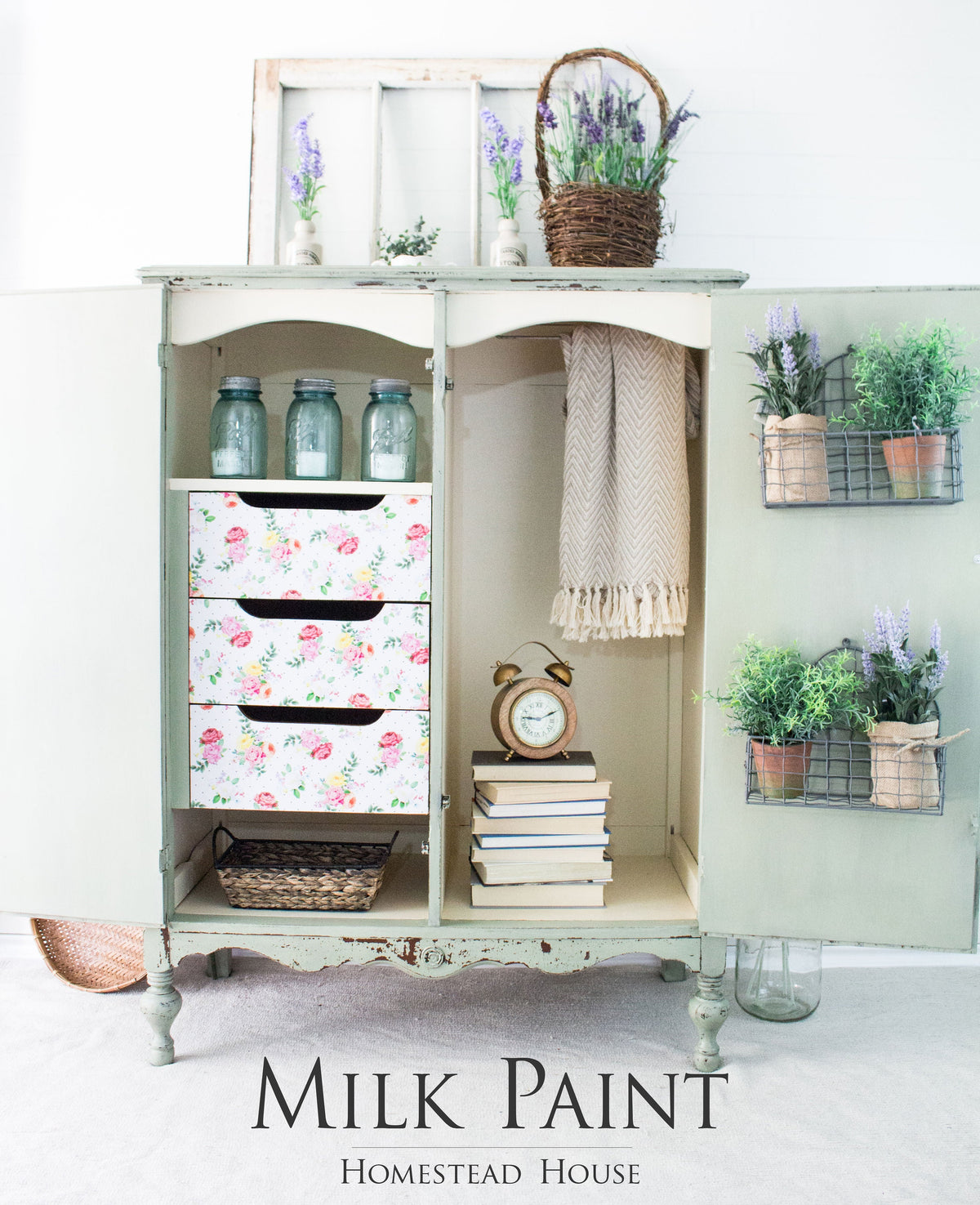 Vintage cabinet with floral-design drawers, books, jars, and lavender, painted in Cartier Milk Paint by Homestead House.