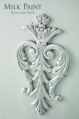 Distressed white applique on pale green, “Cartier Milk Paint by Homestead House” text above.