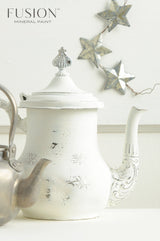 White teapot painted in Casement Fusion Mineral Paint next to a kettle.