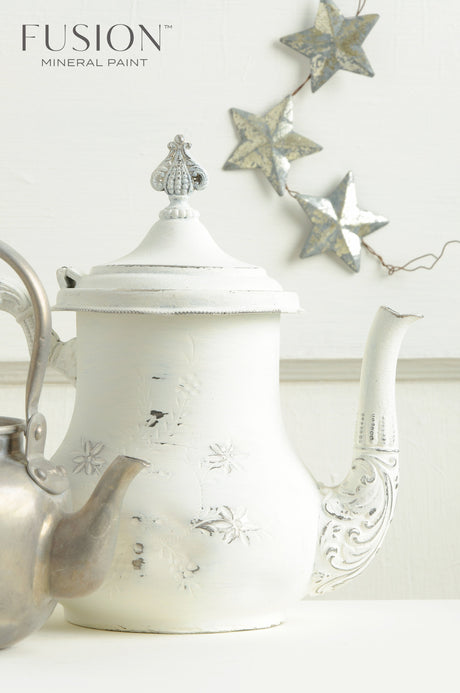 White teapot painted in Casement Fusion Mineral Paint next to a kettle.