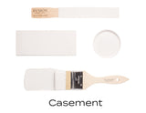 Brush, lid, and two paint swatches of Casement by Fusion Mineral Paint, warm white color shown.