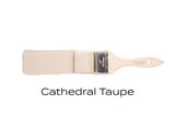 Paintbrush with light taupe Fusion Mineral Paint shown above a swatch labeled ‘Cathedral Taupe’.