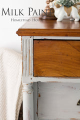 Wooden dresser with Cathedral Taupe Milk Paint by Homestead House; text reads “Milk Paint Homestead House.”.