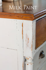 White dresser with wood top and Homestead House Cathedral Taupe Milk Paint overlay text.