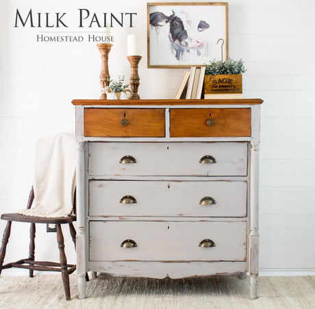 Cathedral Taupe Milk Paint dresser by Homestead House, decor accents, cow art, and a wooden chair nearby.
