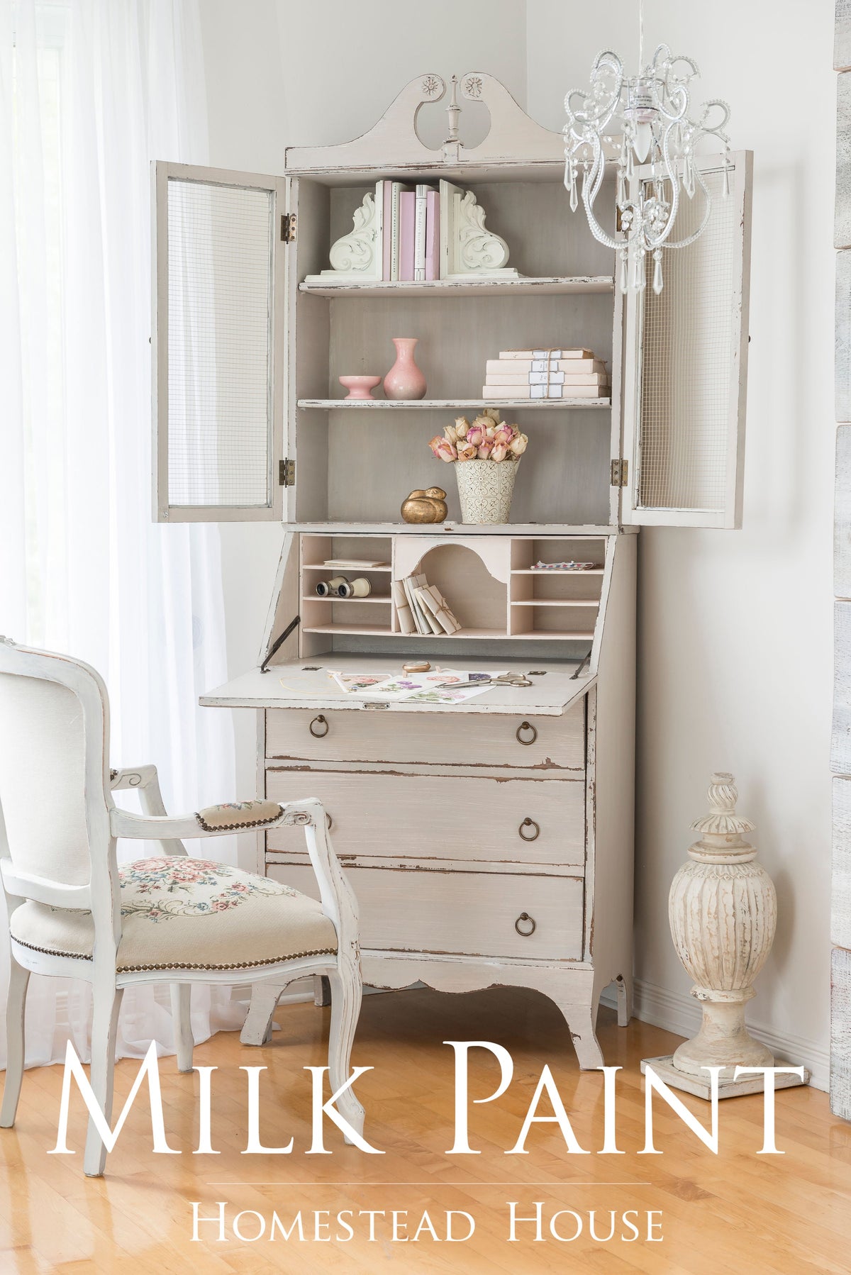 White desk with shelves, books, vases, and chair. Text: Cathedral Taupe Milk Paint by Homestead House.
