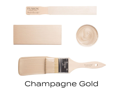 Champagne Gold Metallic Fusion Mineral Paint with stirring stick, block, brush, and shimmering mica pigments.