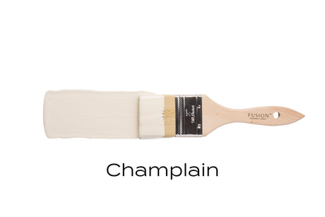 Champlain Fusion Mineral Paint in warm white shown with a paintbrush.