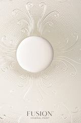 Textured glass sample with a white circle above Champlain Fusion Mineral Paint label.