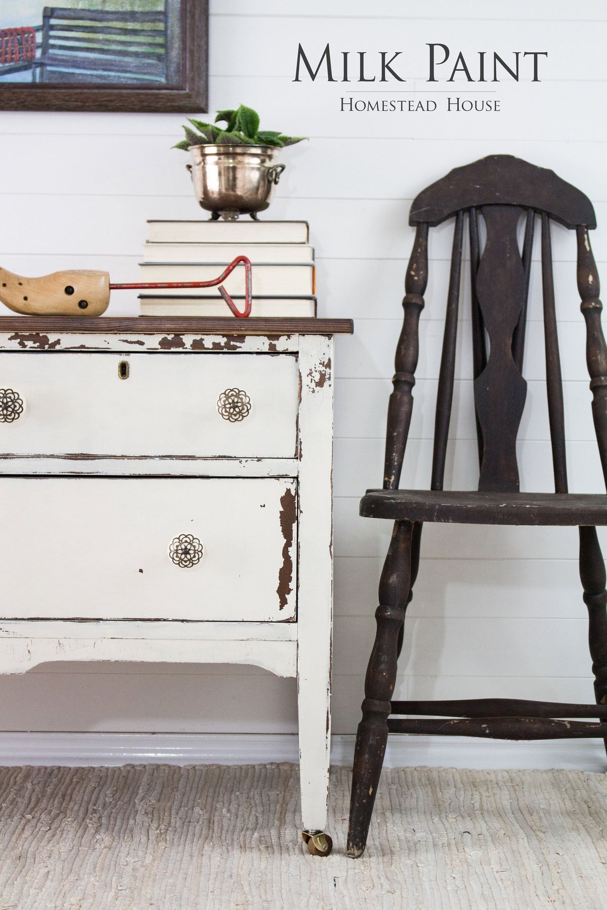 Rustic chair and dresser in Homestead House Champlain Milk Paint beside books, plant pot, and toys on a rug.