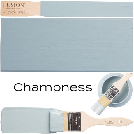 Brush with light blue Champness Fusion Mineral Paint, paint swatches, and matte Fusion Mineral Paint lid shown.