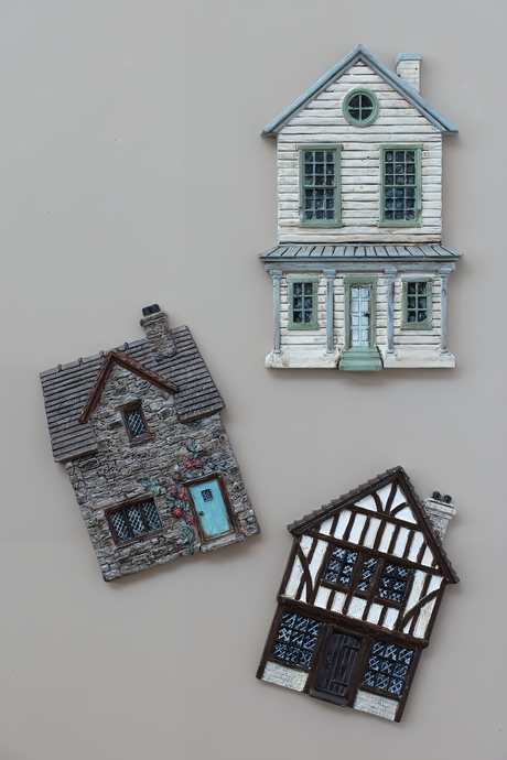 Three cottage magnets made with Charlbury Lane Mould by IOD (I.O.D.) on a plain background.