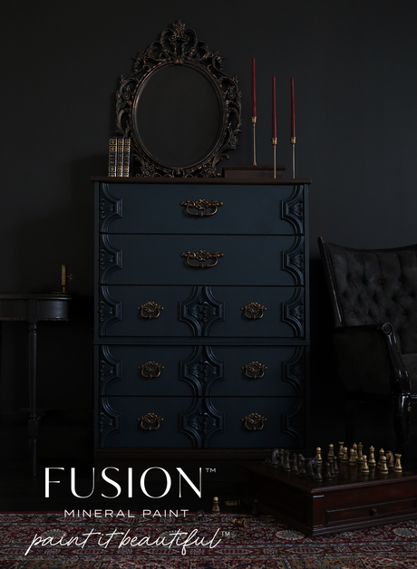Dresser in Chestler by Fusion Mineral Paint, matte finish, shown with round mirror, candlesticks, and chessboard.