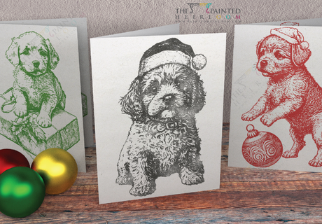 Set of 3 holiday cards with I.O.D. Christmas Pups Stamp (2023), dogs in Santa hats among ornaments on wood.