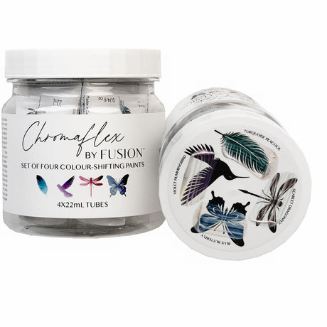 Two ChromaFlex by Fusion Mineral Paint jars with bird and feather lids, showing a color-shifting finish.