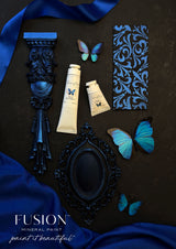 ChromaFlex by Fusion Mineral Paint, blue decor with butterflies and shimmering fabric on dark background.