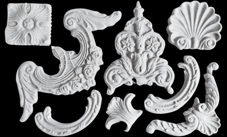 I.O.D. Classic Elements Mould white plaster ornaments displayed on a black background.