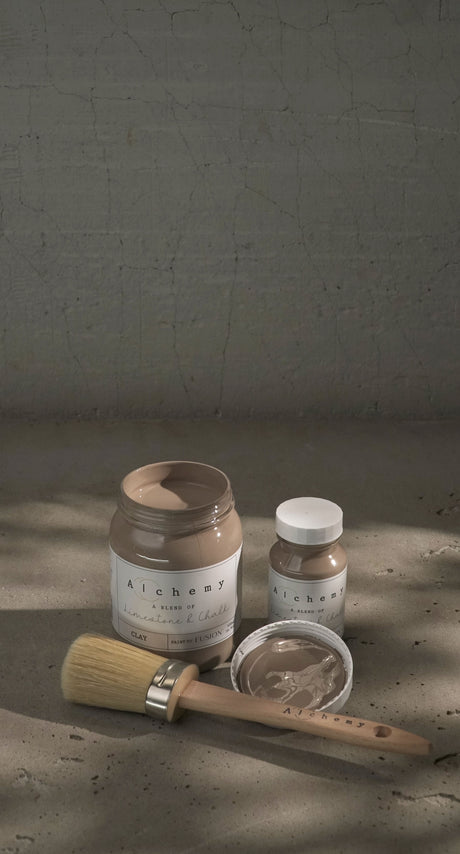 Fusion Mineral Paint Clay Alchemy jars and a clay dish on taupe-gray paint surface.