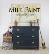 Blue dresser painted with Homestead House’s Coal Black Milk Paint, shown against a neutral wall.