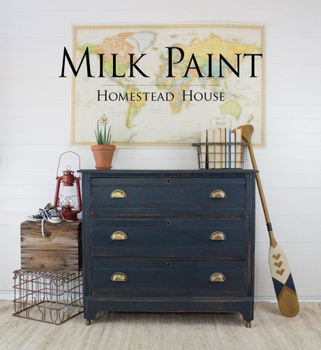 Blue dresser painted with Homestead House’s Coal Black Milk Paint, shown against a neutral wall.