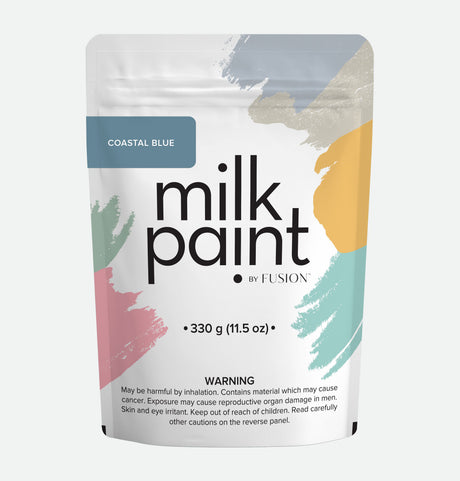 Fusion Mineral Paint Coastal Blue Milk Paint 330g pouch with warning label and vibrant brushstroke design.
