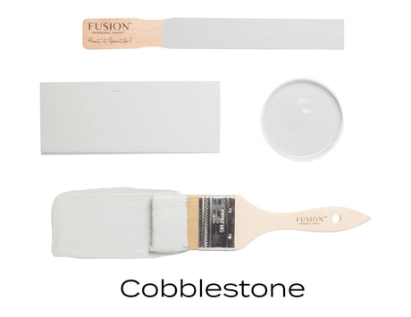 Rectangular swatch, round dish, and brush with warm grey Cobblestone Fusion Mineral Paint by Fusion Mineral Paint.