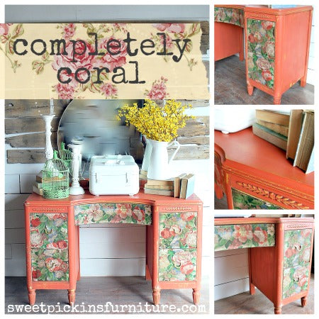 Vintage desk in Completely Coral by Old Fashioned Milk Paint with floral decoupage, styled with books and flowers.