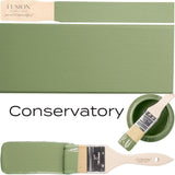 Conservatory by Fusion Mineral Paint mid-tone green acrylic displayed on swatches and in an open can.