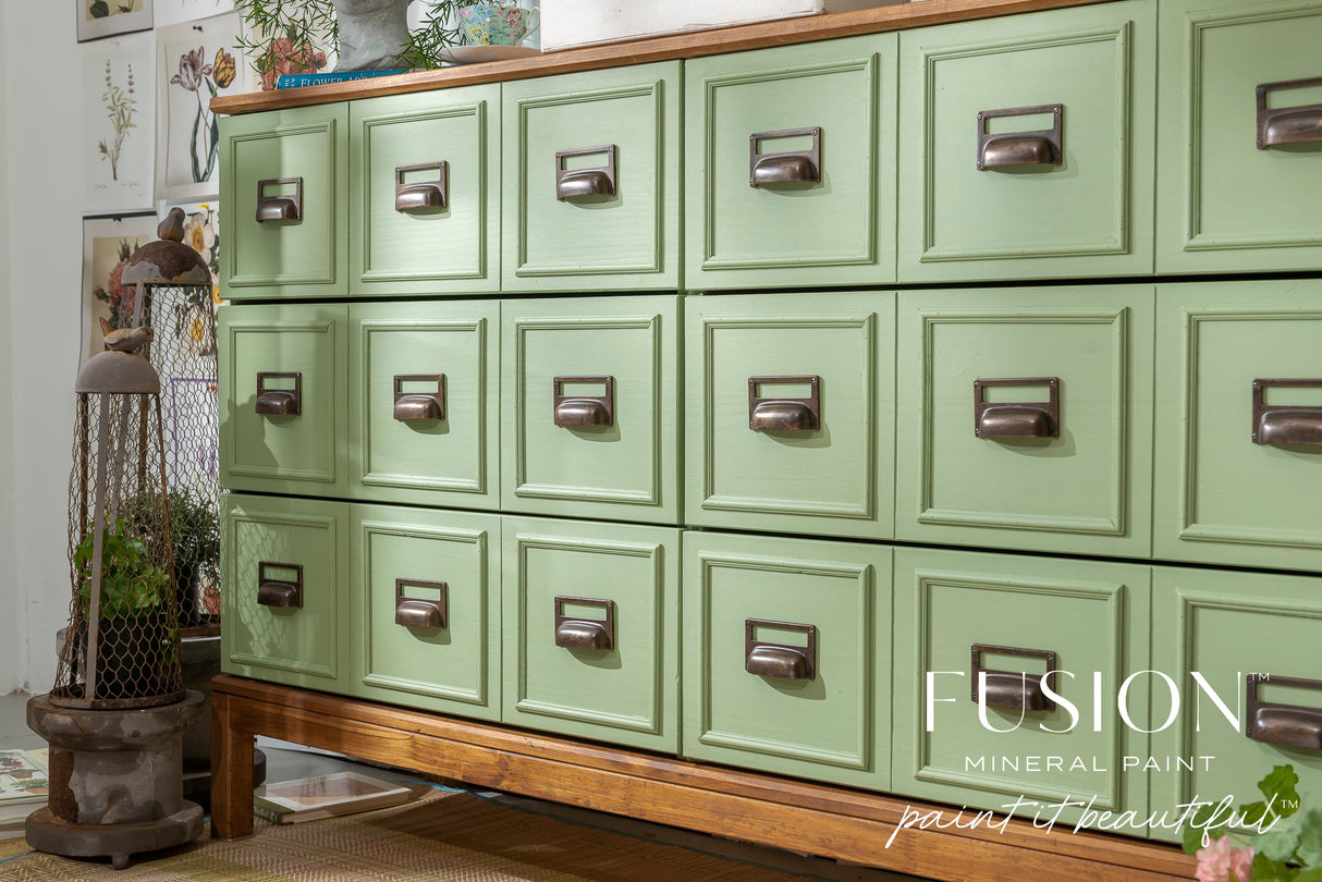 Green apothecary cabinet in Conservatory Fusion Mineral Paint on wood base.
