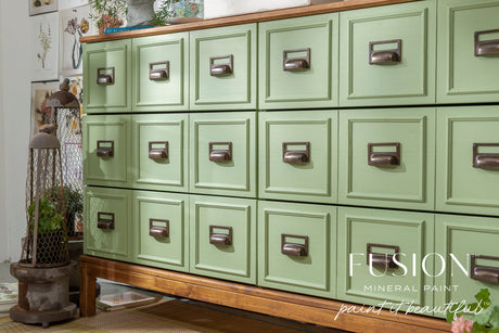 Green apothecary cabinet in Conservatory Fusion Mineral Paint on wood base.