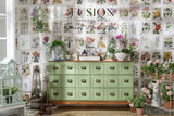 Green cabinet with drawers by Fusion Mineral Paint in Conservatory green, shown with potted plants and garden decor.