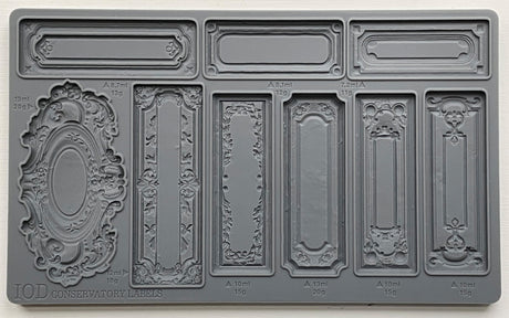 Conservatory Labels Mould by I.O.D. featuring 8 ornate, vintage-inspired label designs for crafts and décor projects.