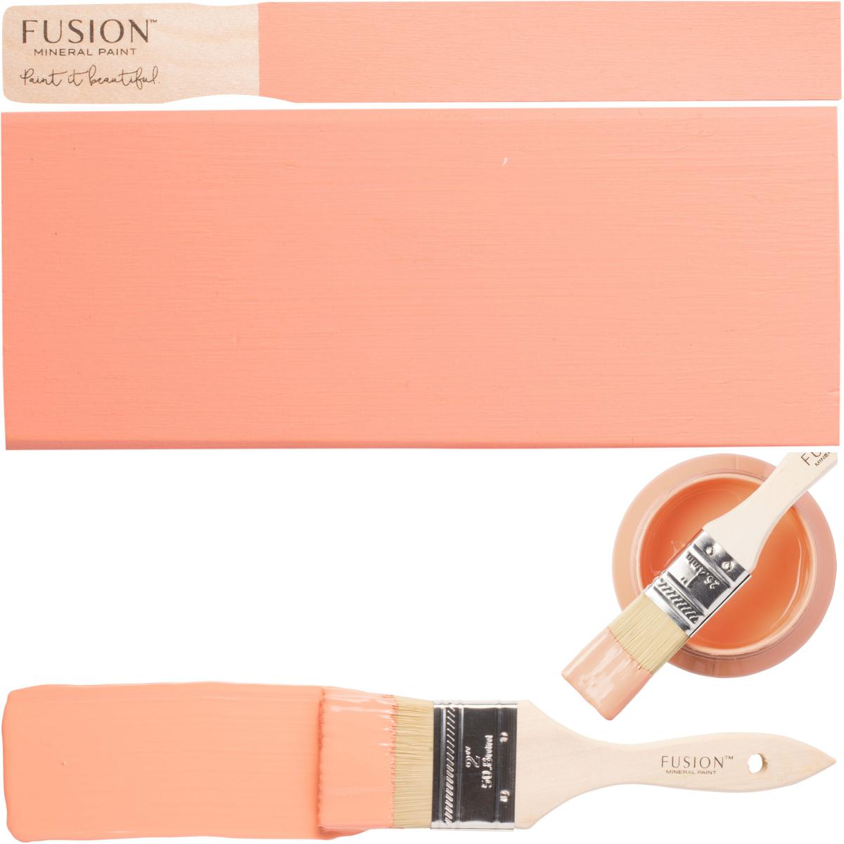 Fusion Mineral Paint Coral, open can with matte finish, brush, and board shown together.