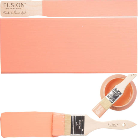 Fusion Mineral Paint Coral, open can with matte finish, brush, and board shown together.