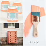 Coral Fusion Mineral Paint jars, painted dresser, and paintbrush with coral matte paint shown together.