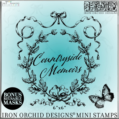 Blue square label with ornate black frame, IOD Countryside Memoirs Mini-Stamp, butterfly, and ribbon.