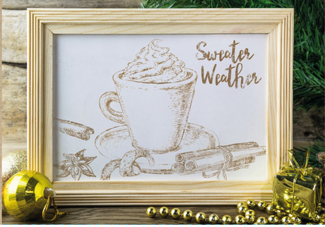 Framed mug sketch with whipped cream, “Sweater Weather,” festive greenery, and I.O.D. Cozy Stamp.