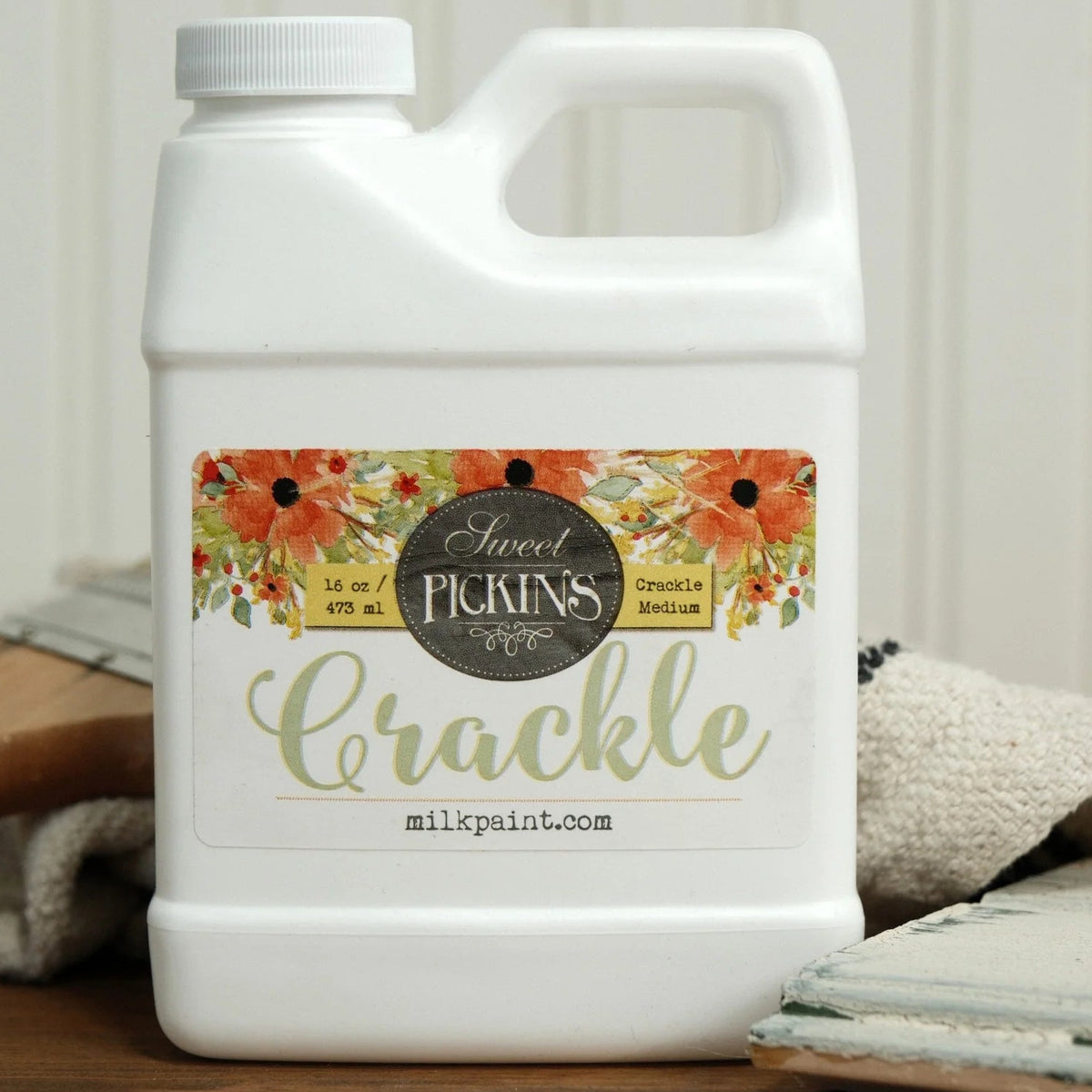 16 oz Old Fashioned Milk Paint Crackle bottle displayed upright on a plain tabletop.