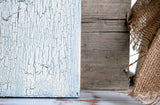 Crackle by Old Fashioned Milk Paint on wood, plain brown wood, and frayed burlap fabric displayed side by side.