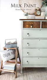 Dresser and step stool painted in Craftsman Milk Paint by Homestead House, styled with books.