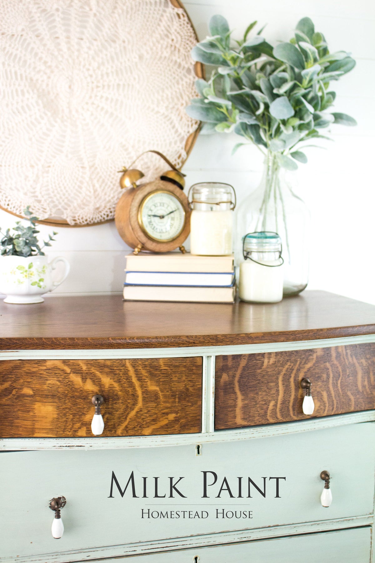 Vintage dresser with decor, showcasing Homestead House Craftsman Milk Paint’s rich coverage.