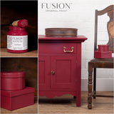 Red wooden chair beside Cranberry Fusion Mineral Paint by Fusion Mineral Paint on display.