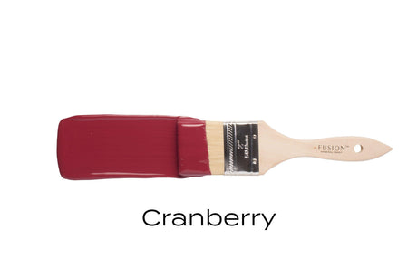 Paintbrush with cranberry-colored bristles and handle, “Cranberry Fusion Mineral Paint” displayed below.