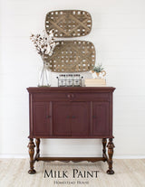 Dark wood sideboard with baskets, finished in Homestead House Cranberry Milk Paint.