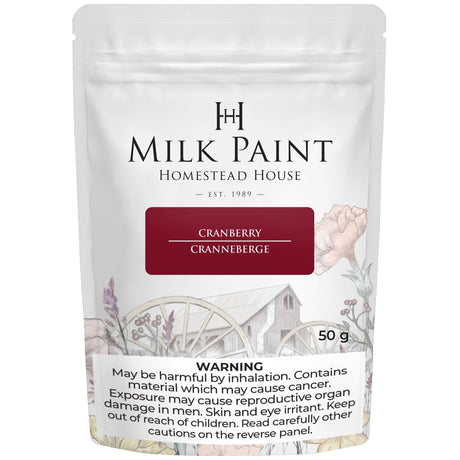 Homestead House Cranberry Milk Paint 50g bag with floral art and a visible warning label on the packaging.