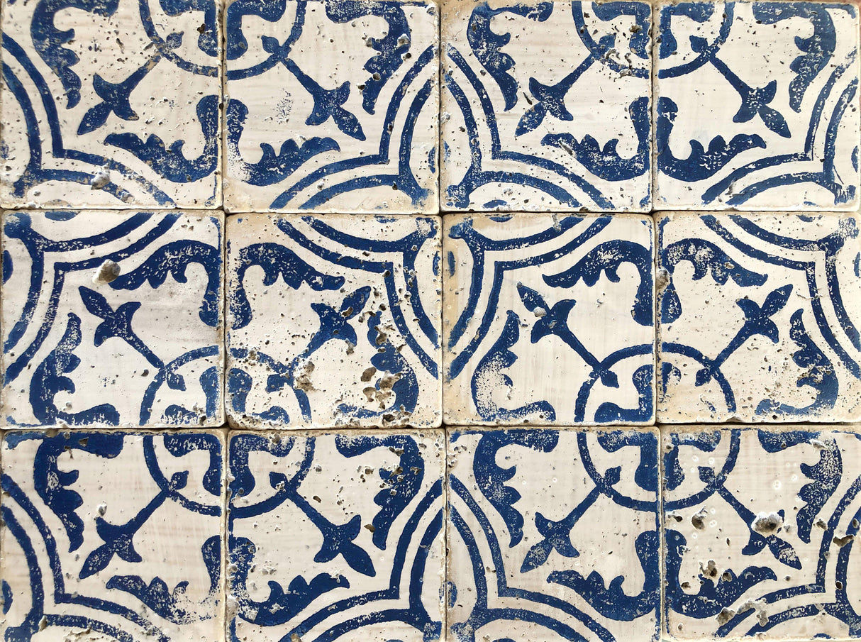 Nine white tiles with blue patterns, aged look, made using I.O.D. Cubano Tile Stamp (Retired) by Iron Orchid Designs.